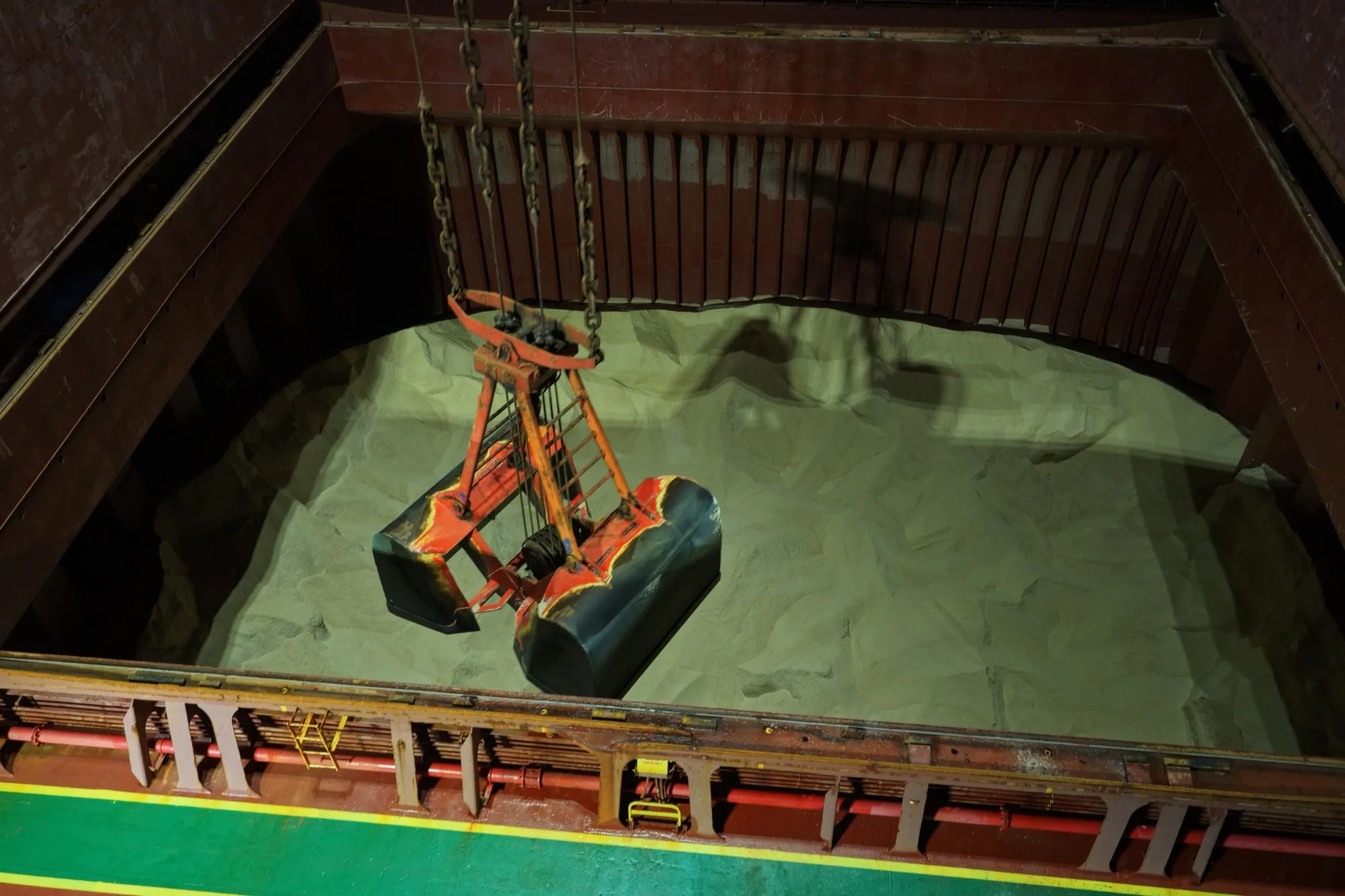 The grab working inside a hold of rock salt